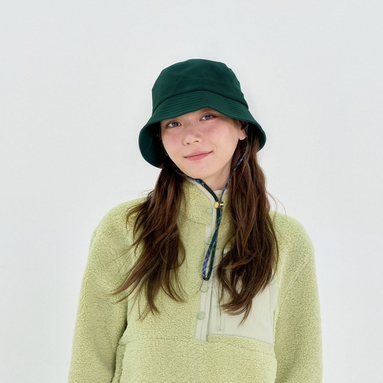 Green bucket store hat with string